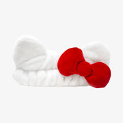 Bandeau THE CREME SHOP avec nœud papillon rouge